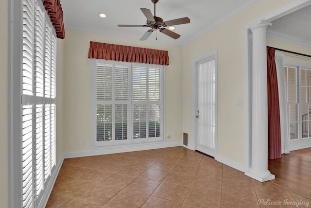 interior space with ceiling fan, ornamental molding, decorative columns, and light tile patterned floors