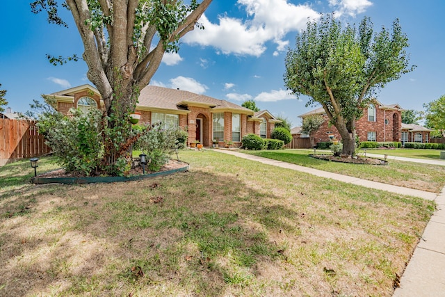 ranch-style home with a front yard