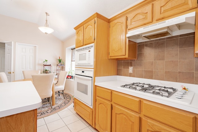 kitchen featuring lofted ceiling, white appliances, light tile patterned floors, backsplash, and ventilation hood