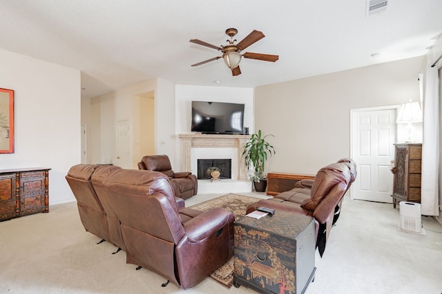 living room featuring light carpet and ceiling fan