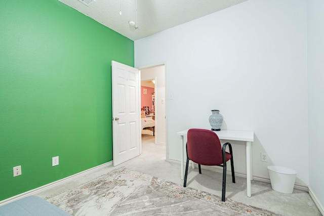 home office featuring a textured ceiling