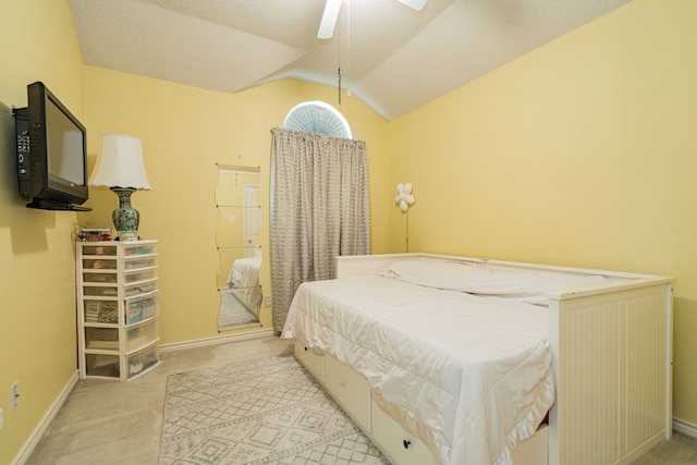 bedroom with lofted ceiling, light colored carpet, and ceiling fan