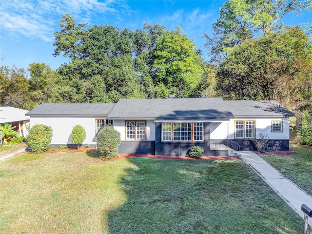 ranch-style home featuring a front yard