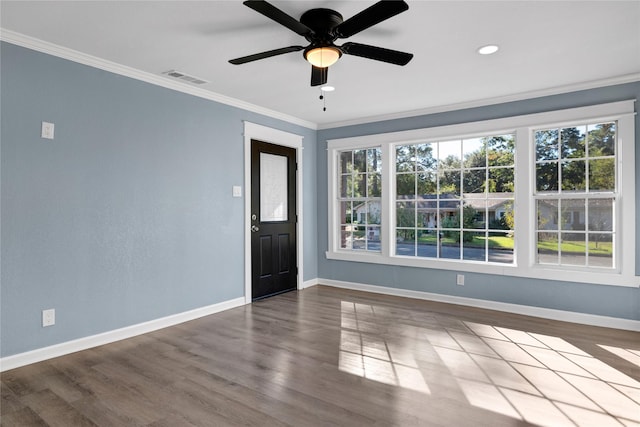 spare room with ceiling fan, ornamental molding, and hardwood / wood-style floors