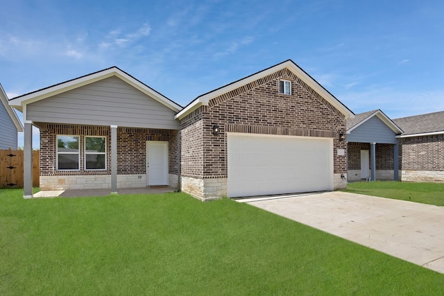 view of front of property with a garage and a front lawn