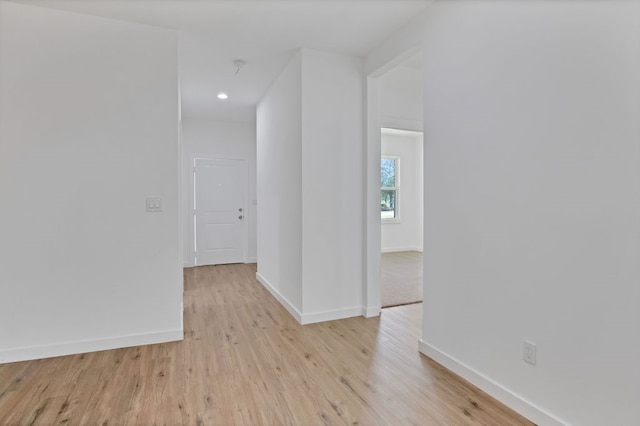 hallway with light wood-type flooring