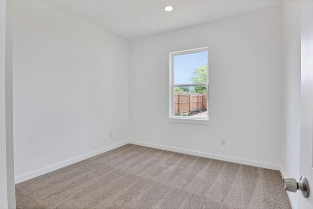 unfurnished room featuring carpet