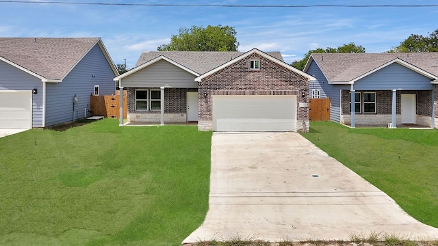 view of front facade with a garage and a front lawn