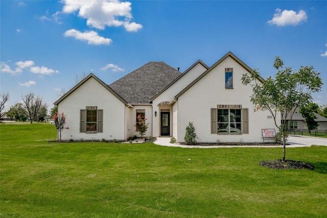 view of front of home with a front yard