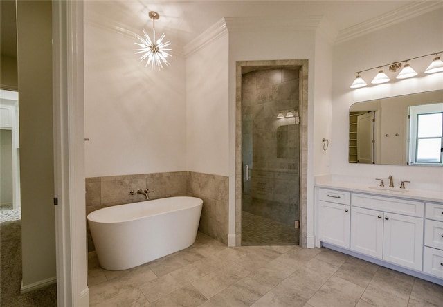 bathroom featuring crown molding, tile walls, vanity, independent shower and bath, and a notable chandelier