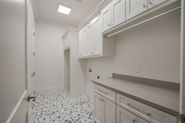 clothes washing area featuring crown molding, hookup for a washing machine, cabinets, and hookup for an electric dryer