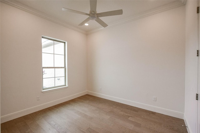 unfurnished room featuring ornamental molding, ceiling fan, and light wood-type flooring