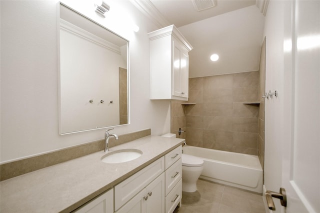 full bathroom featuring tile patterned floors, toilet, tiled shower / bath combo, and vanity