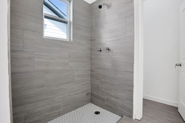 bathroom with a tile shower