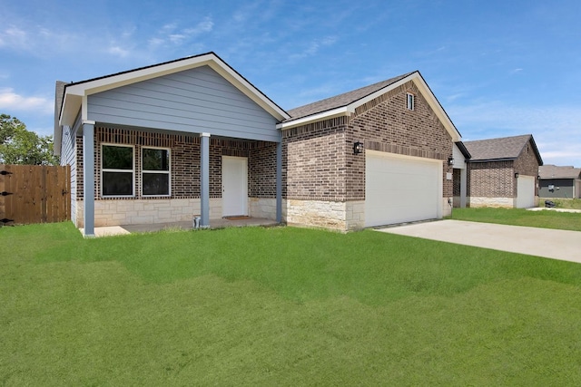 view of front of property featuring a garage and a front lawn