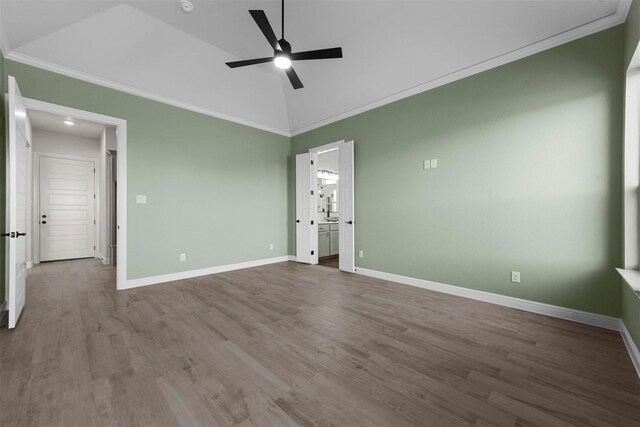 unfurnished bedroom with ceiling fan, wood-type flooring, crown molding, and vaulted ceiling