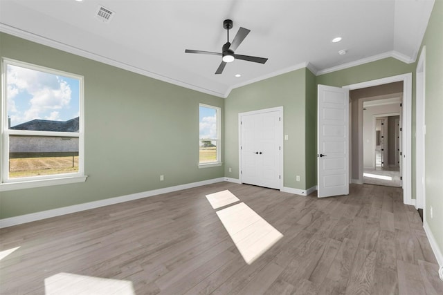 unfurnished bedroom with ceiling fan, light hardwood / wood-style flooring, and ornamental molding