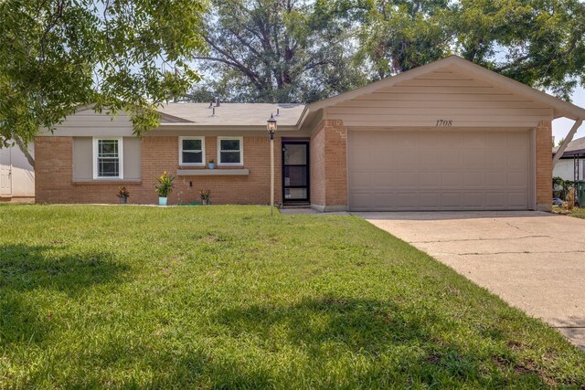 ranch-style house featuring a garage and a front lawn