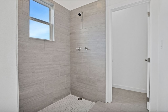 bathroom with tiled shower