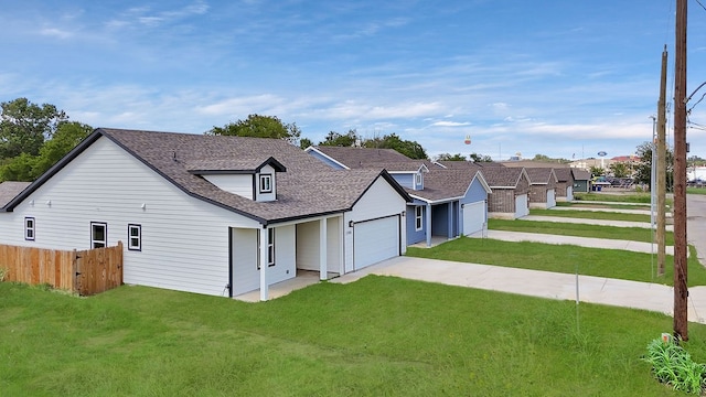 view of front facade with a garage and a front lawn