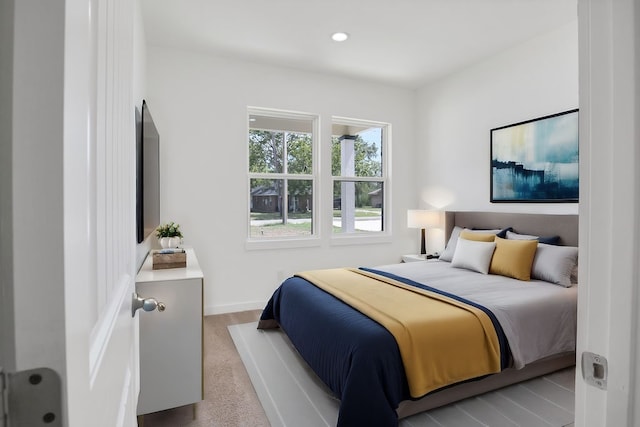 bedroom with light wood-type flooring