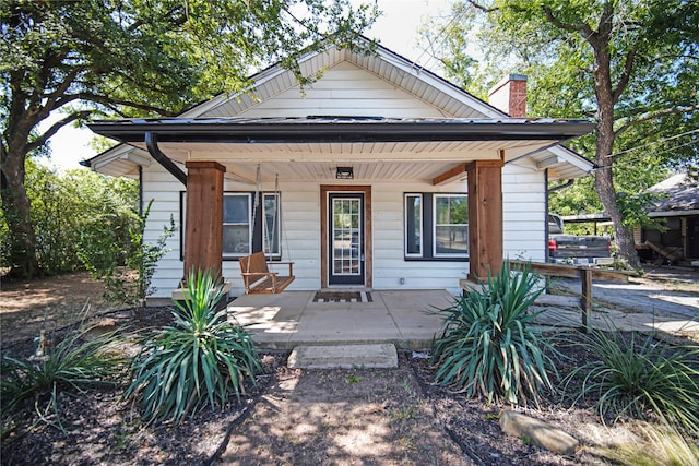 bungalow-style house with covered porch