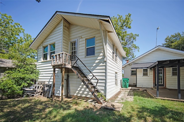 rear view of house with a lawn