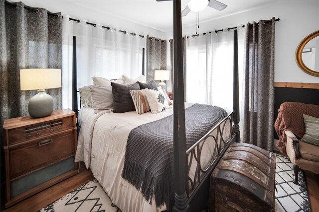 bedroom featuring ceiling fan and hardwood / wood-style floors