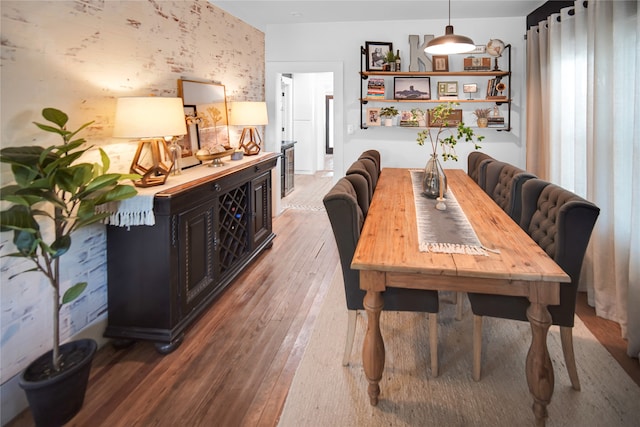 dining space featuring wood-type flooring