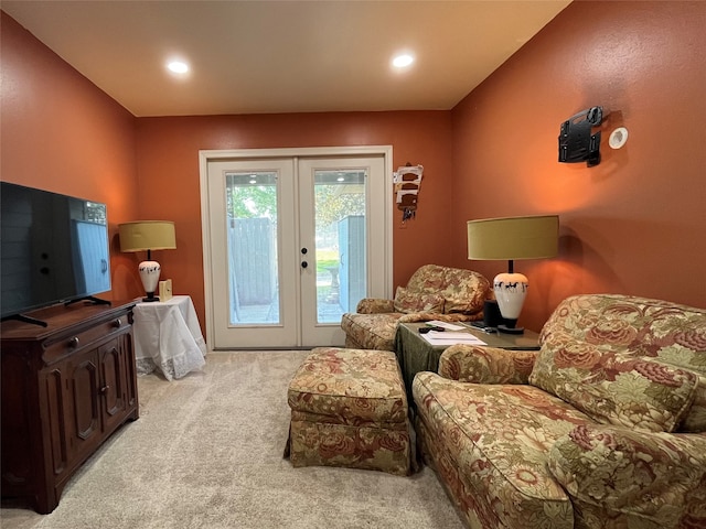 living room with french doors and light carpet