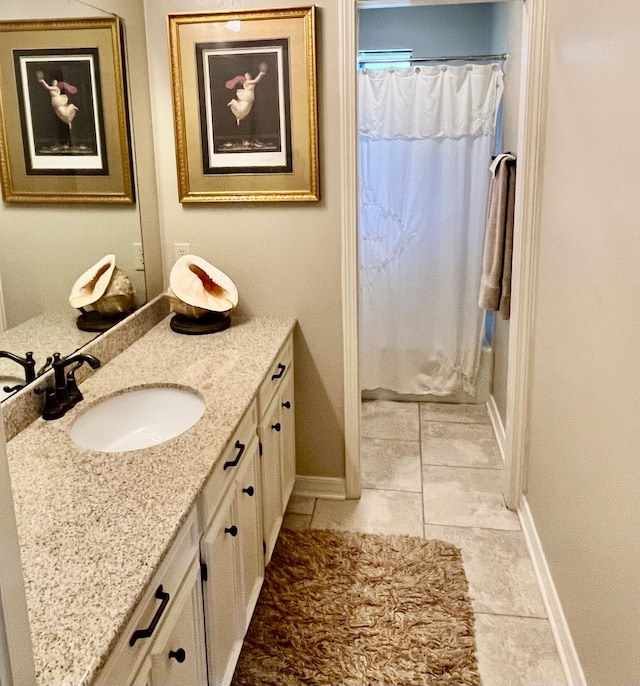 bathroom featuring vanity and tile patterned flooring