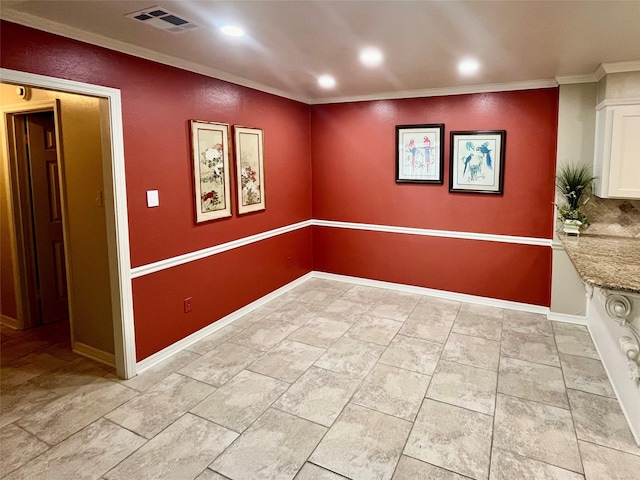 unfurnished room with ornamental molding