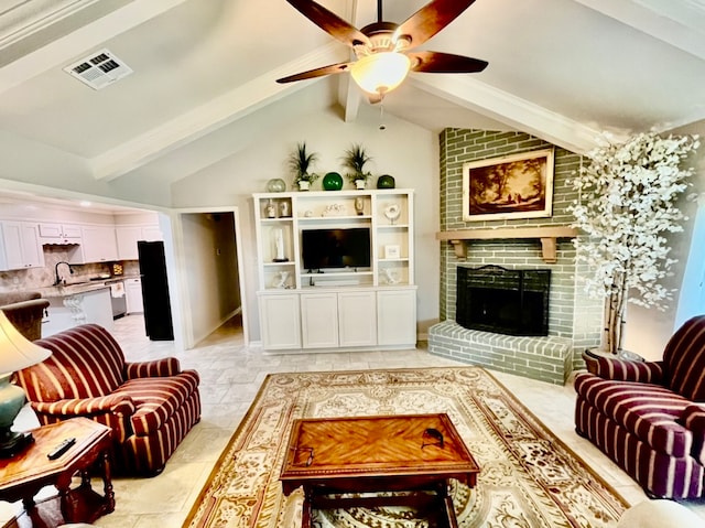 tiled living room featuring ceiling fan, brick wall, a fireplace, and lofted ceiling with beams