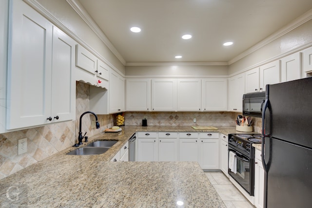 kitchen featuring white cabinets, tasteful backsplash, sink, and black appliances