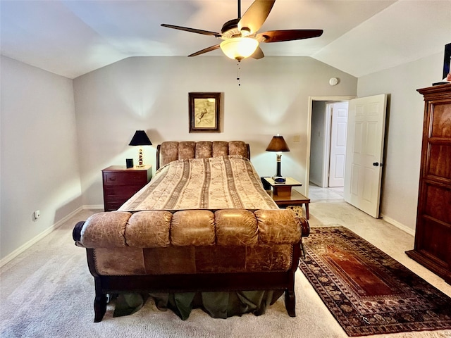 bedroom with light carpet, vaulted ceiling, and ceiling fan