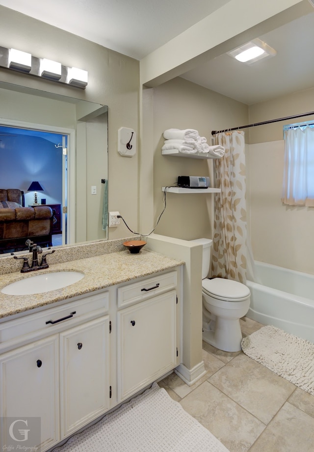 full bathroom featuring shower / tub combo with curtain, tile patterned flooring, vanity, and toilet