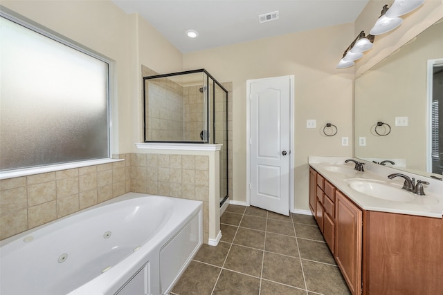 bathroom featuring vanity, separate shower and tub, and tile patterned flooring