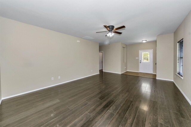 tiled spare room with ceiling fan