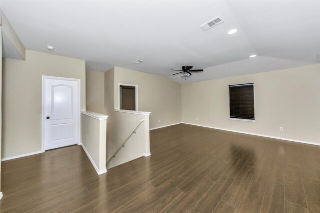 living room featuring ceiling fan, lofted ceiling, and dark hardwood / wood-style flooring