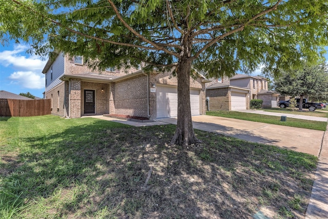 view of front of home with a front lawn and a garage