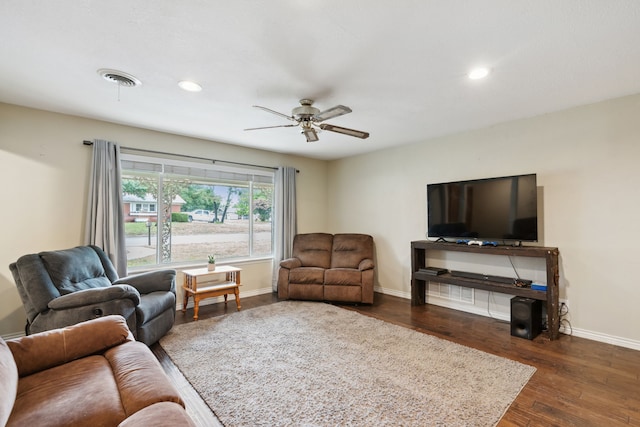 living room with ceiling fan and dark hardwood / wood-style floors