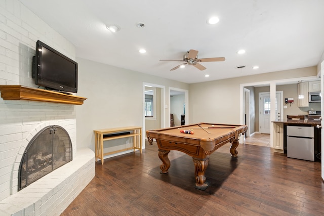 playroom featuring a fireplace, ceiling fan, wood-type flooring, and billiards