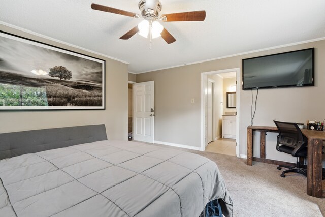 bedroom featuring light carpet, connected bathroom, crown molding, and ceiling fan