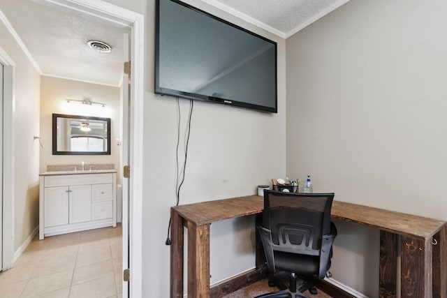 office with sink, light tile patterned floors, a textured ceiling, and crown molding