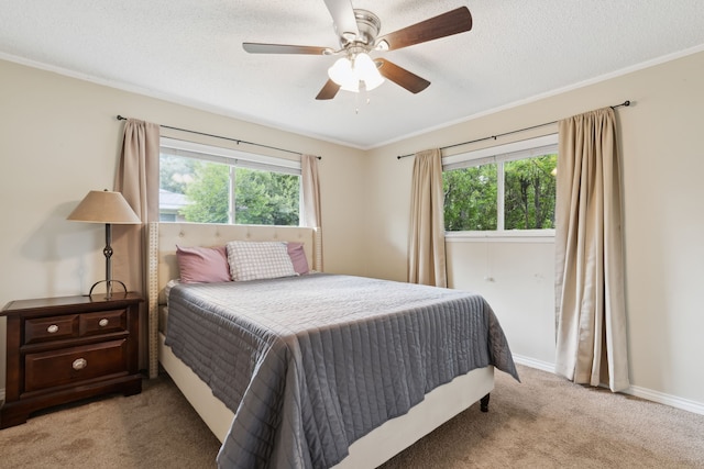 bedroom with light colored carpet, multiple windows, and ceiling fan