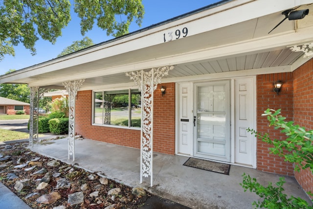 doorway to property featuring a porch