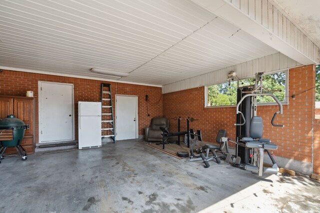 garage featuring white fridge