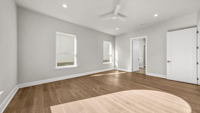 unfurnished room featuring hardwood / wood-style floors and ceiling fan