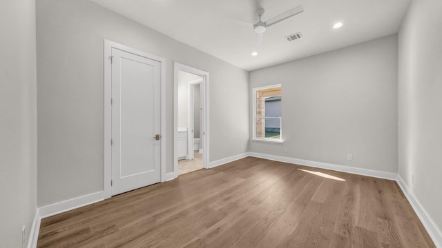 unfurnished room featuring hardwood / wood-style flooring and ceiling fan