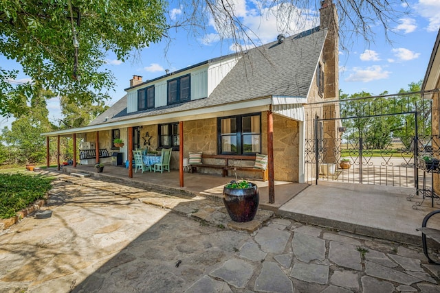 back of house with a patio